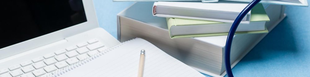 Medical research stethoscope lying on doctor book Medical research stethoscope lying on doctor book pen and paper